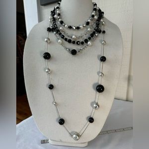 Two black and silvertone layering necklaces